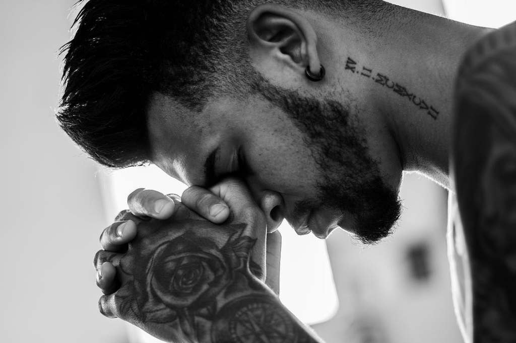 Description: Man Tattooed Praying